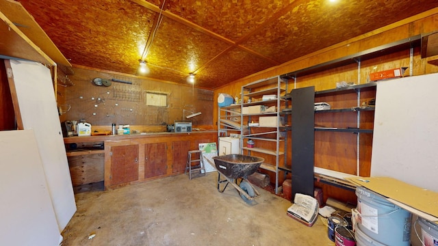 basement featuring washer / dryer and a workshop area