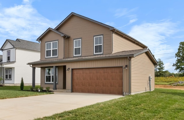 view of front of property featuring a front lawn and a garage