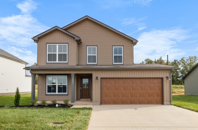 view of property with a garage and a front lawn