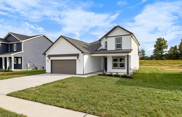 view of front of property featuring a front yard and a garage