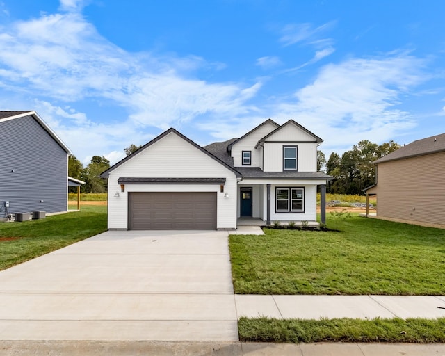 view of front of house with a front yard and a garage