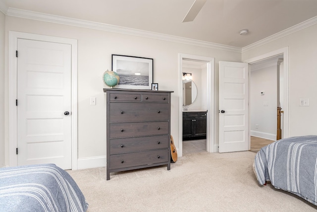 bedroom featuring ceiling fan, ensuite bathroom, light colored carpet, and ornamental molding