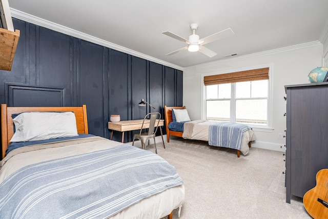 carpeted bedroom with ceiling fan and crown molding