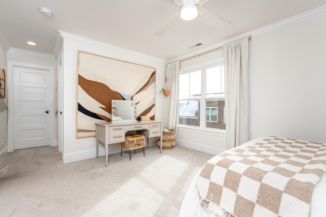 carpeted bedroom with ceiling fan and crown molding