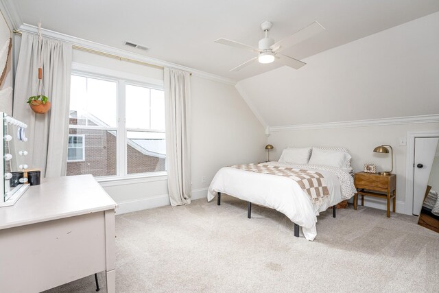 carpeted bedroom with multiple windows, ceiling fan, and lofted ceiling