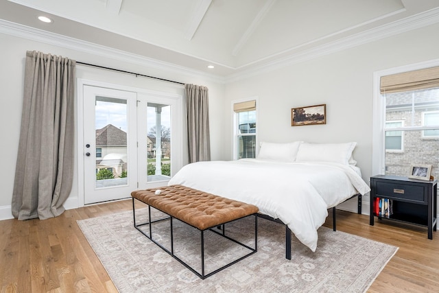 bedroom featuring lofted ceiling with beams, access to outside, crown molding, and light hardwood / wood-style floors