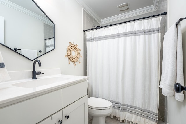 bathroom with crown molding, vanity, and toilet