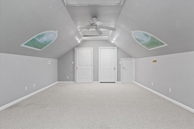 bonus room featuring lofted ceiling, carpet flooring, and ceiling fan