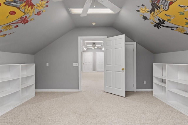 additional living space featuring light carpet, vaulted ceiling, and ceiling fan