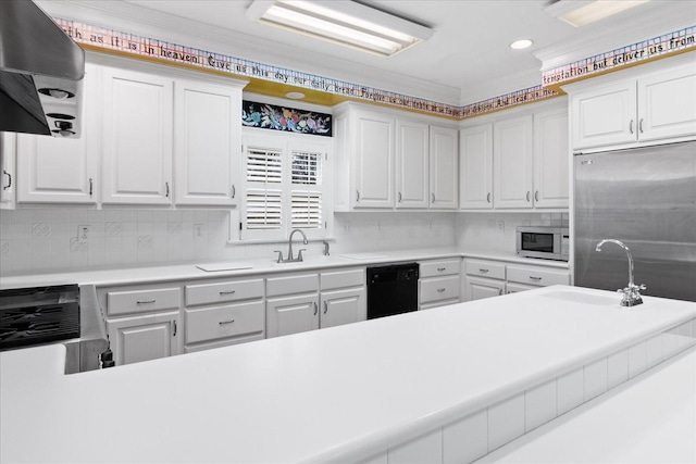 kitchen featuring white cabinetry, stainless steel appliances, and sink