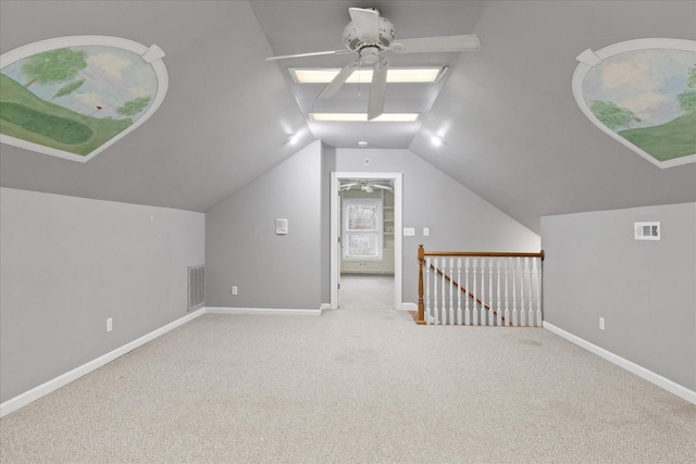 bonus room featuring lofted ceiling, light carpet, and ceiling fan