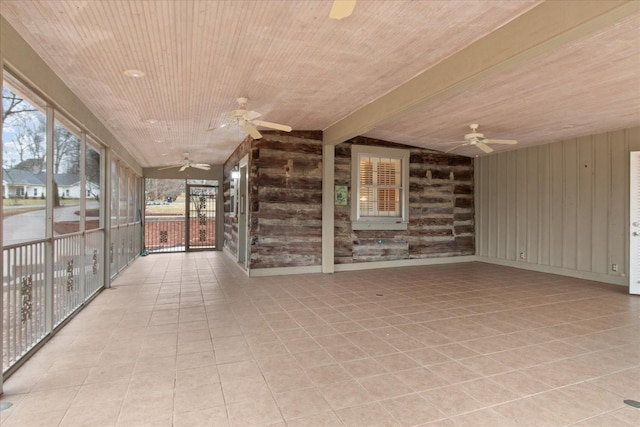 unfurnished sunroom featuring wooden ceiling and ceiling fan