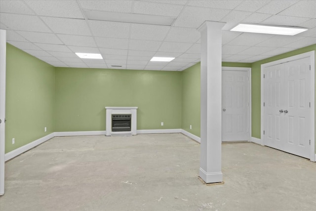 basement featuring a paneled ceiling