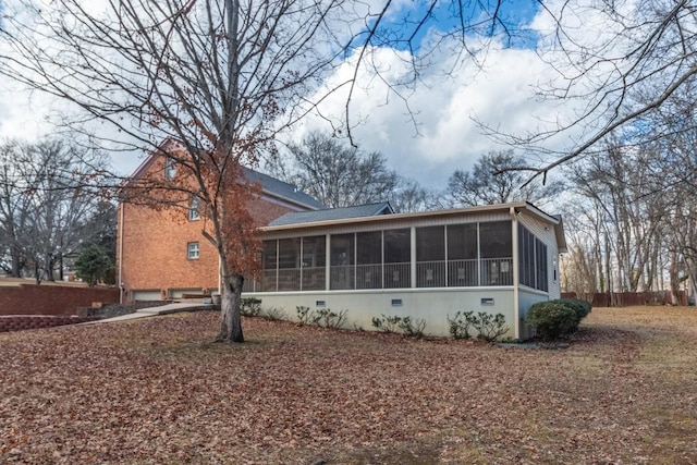 rear view of house with a sunroom