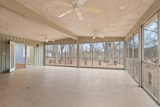 unfurnished sunroom featuring wood ceiling, lofted ceiling with beams, and ceiling fan