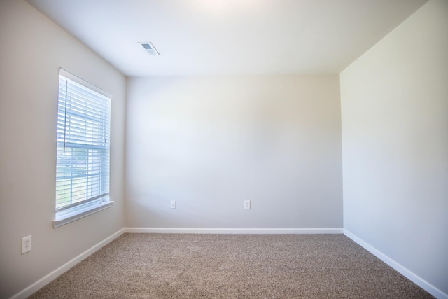 empty room featuring carpet flooring