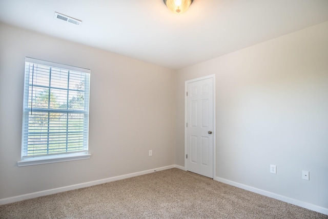 empty room with carpet flooring