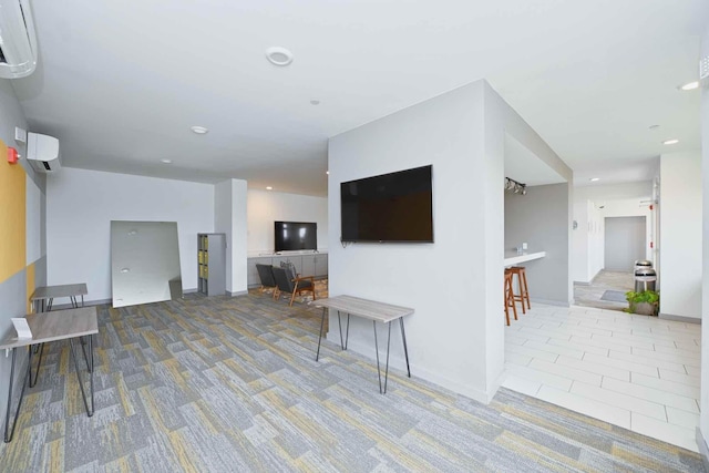 carpeted living room with a wall mounted air conditioner