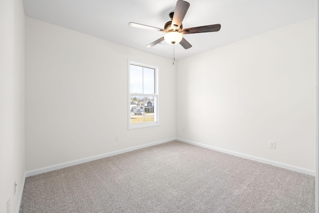 unfurnished room with baseboards, carpet, and ceiling fan