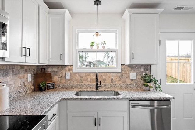 kitchen with a sink, visible vents, plenty of natural light, and appliances with stainless steel finishes