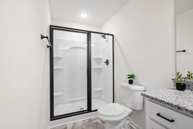 full bathroom featuring vanity, a shower stall, toilet, and marble finish floor