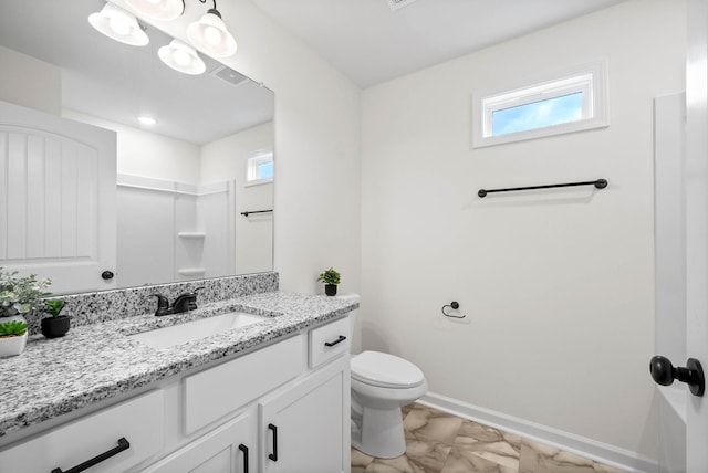 bathroom with vanity, visible vents, baseboards, toilet, and marble finish floor