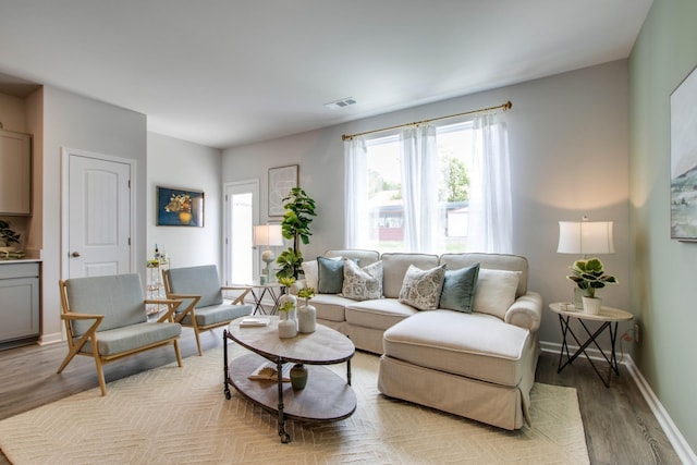 living room with light hardwood / wood-style flooring