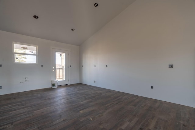 unfurnished room featuring dark hardwood / wood-style flooring and high vaulted ceiling