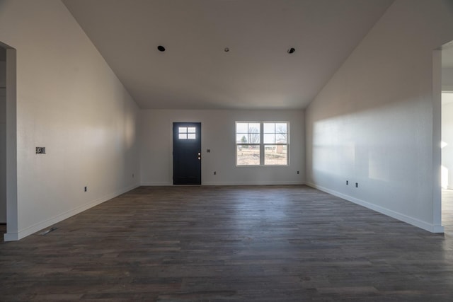 interior space featuring dark hardwood / wood-style floors and vaulted ceiling