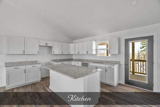 kitchen featuring a wealth of natural light and white cabinetry