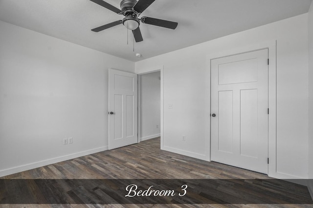 unfurnished bedroom with ceiling fan, baseboards, and wood finished floors