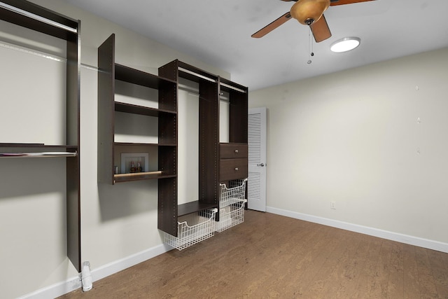 unfurnished bedroom featuring hardwood / wood-style flooring and ceiling fan