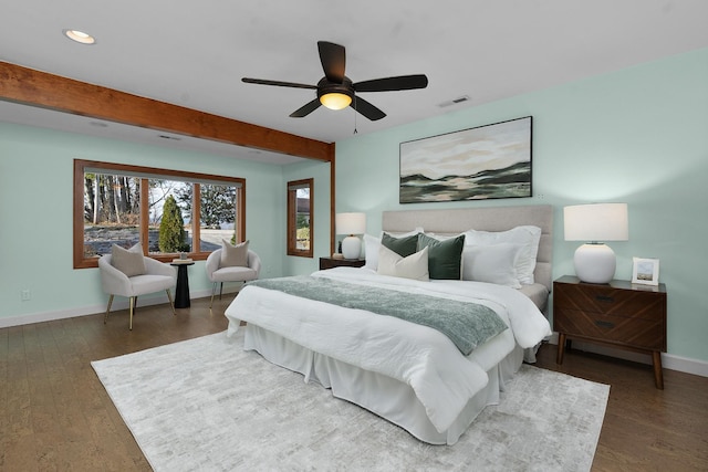 bedroom with beam ceiling, dark hardwood / wood-style floors, and ceiling fan