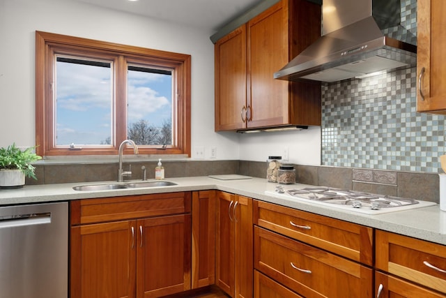 kitchen featuring dishwasher, white gas stovetop, sink, wall chimney exhaust hood, and decorative backsplash