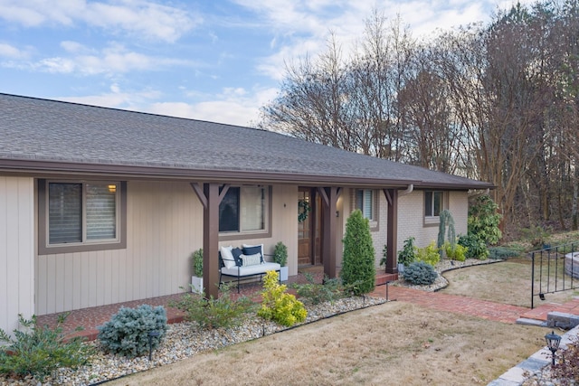 ranch-style home featuring a front yard