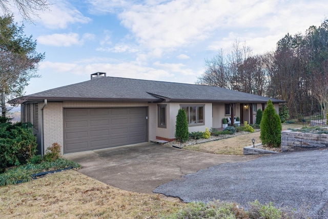 ranch-style home featuring a garage