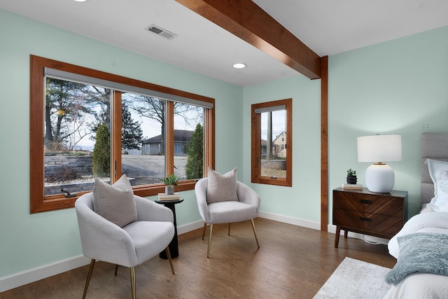 sitting room with beamed ceiling and dark hardwood / wood-style flooring