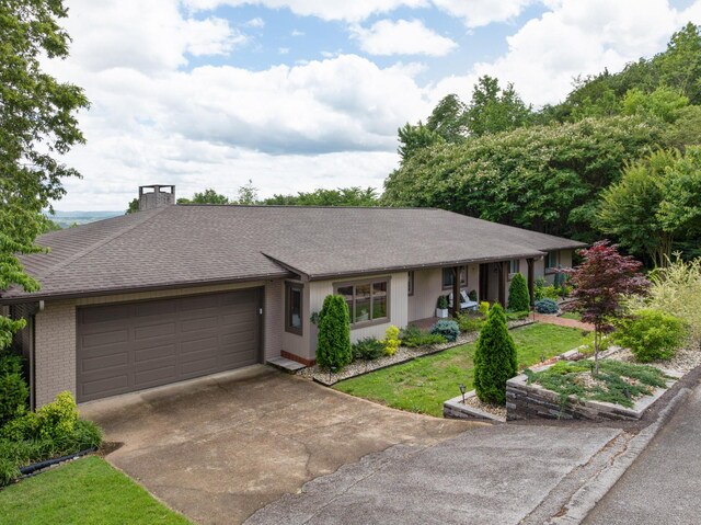 540 N Crest Ct, Chattanooga, TN 37404 - single story home with driveway, brick siding, an attached garage, a chimney, and a shingled roof