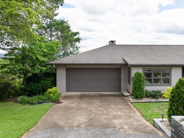 540 N Crest Ct, Chattanooga, TN 37404 - view of front of home featuring brick siding, a garage, concrete driveway, and a shingled roof