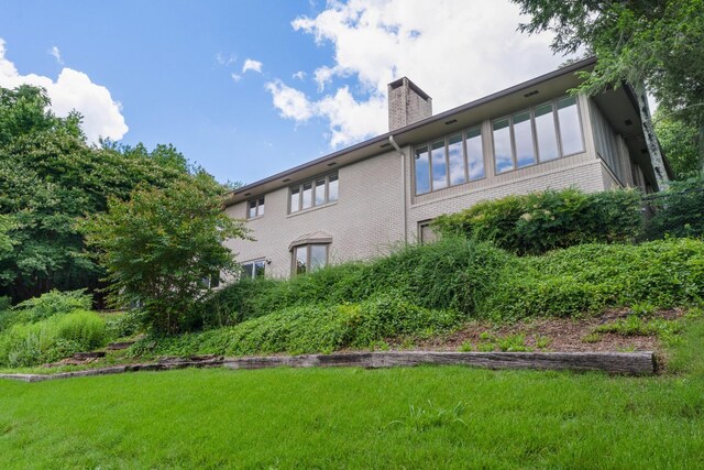 540 N Crest Ct, Chattanooga, TN 37404 - rear view of property featuring a chimney, brick siding, and a lawn