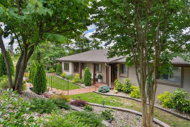 540 N Crest Ct, Chattanooga, TN 37404 - view of front of home with brick siding, a shingled roof, and a front lawn