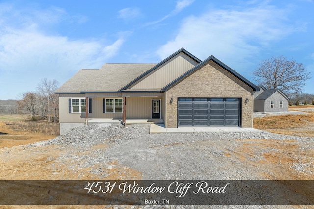 view of front of property with an attached garage and a shingled roof