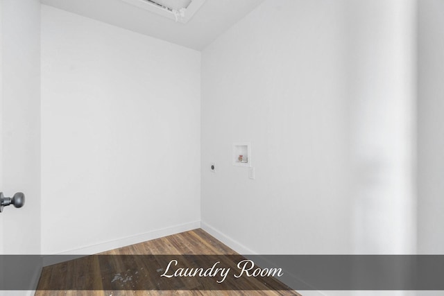 interior space featuring laundry area, baseboards, wood finished floors, washer hookup, and electric dryer hookup