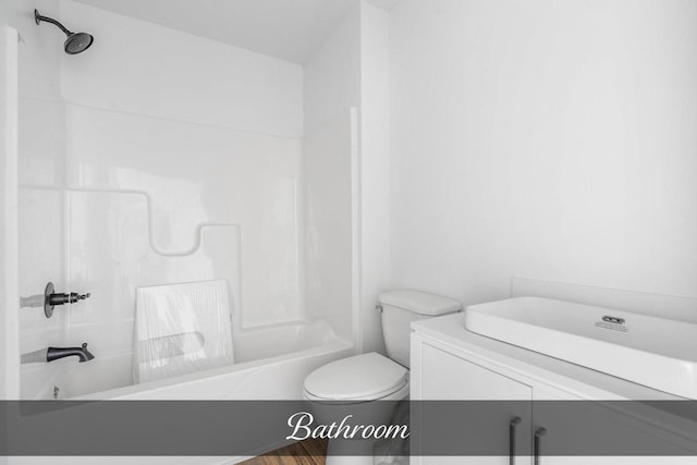 bathroom featuring toilet and tub / shower combination