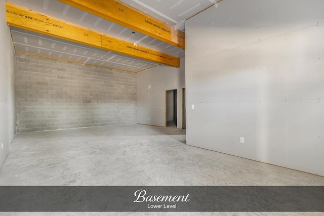 empty room with concrete block wall and concrete floors