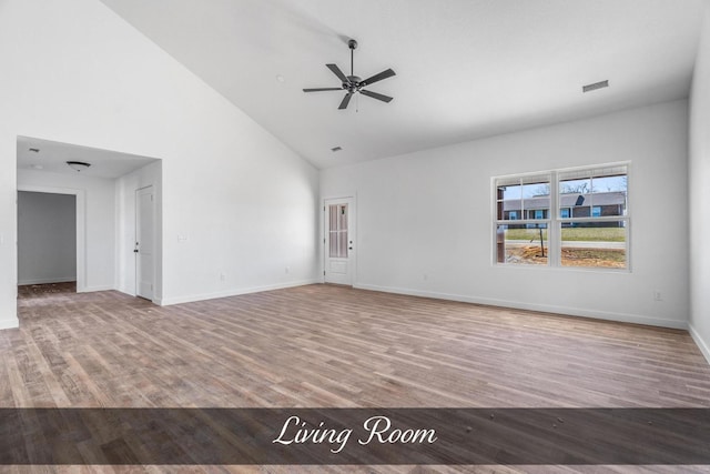 unfurnished living room featuring high vaulted ceiling, wood finished floors, a ceiling fan, and baseboards