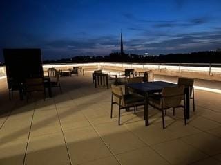 view of patio terrace at dusk