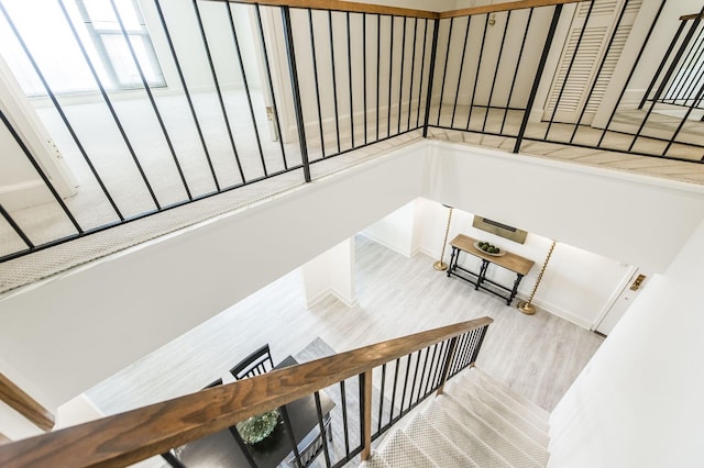 staircase with wood-type flooring