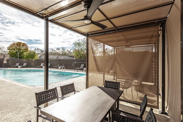 view of swimming pool with a patio area and ceiling fan