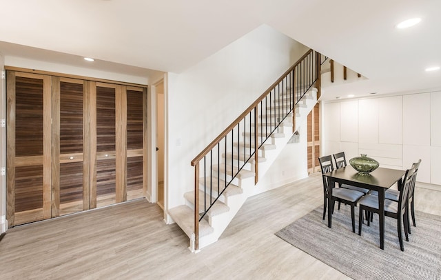 dining space featuring light wood-type flooring